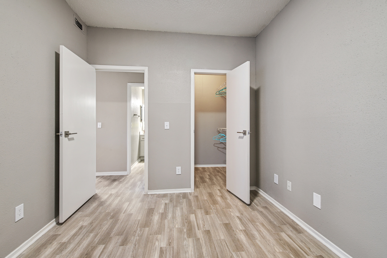 Empty second bedroom with walk-in closet