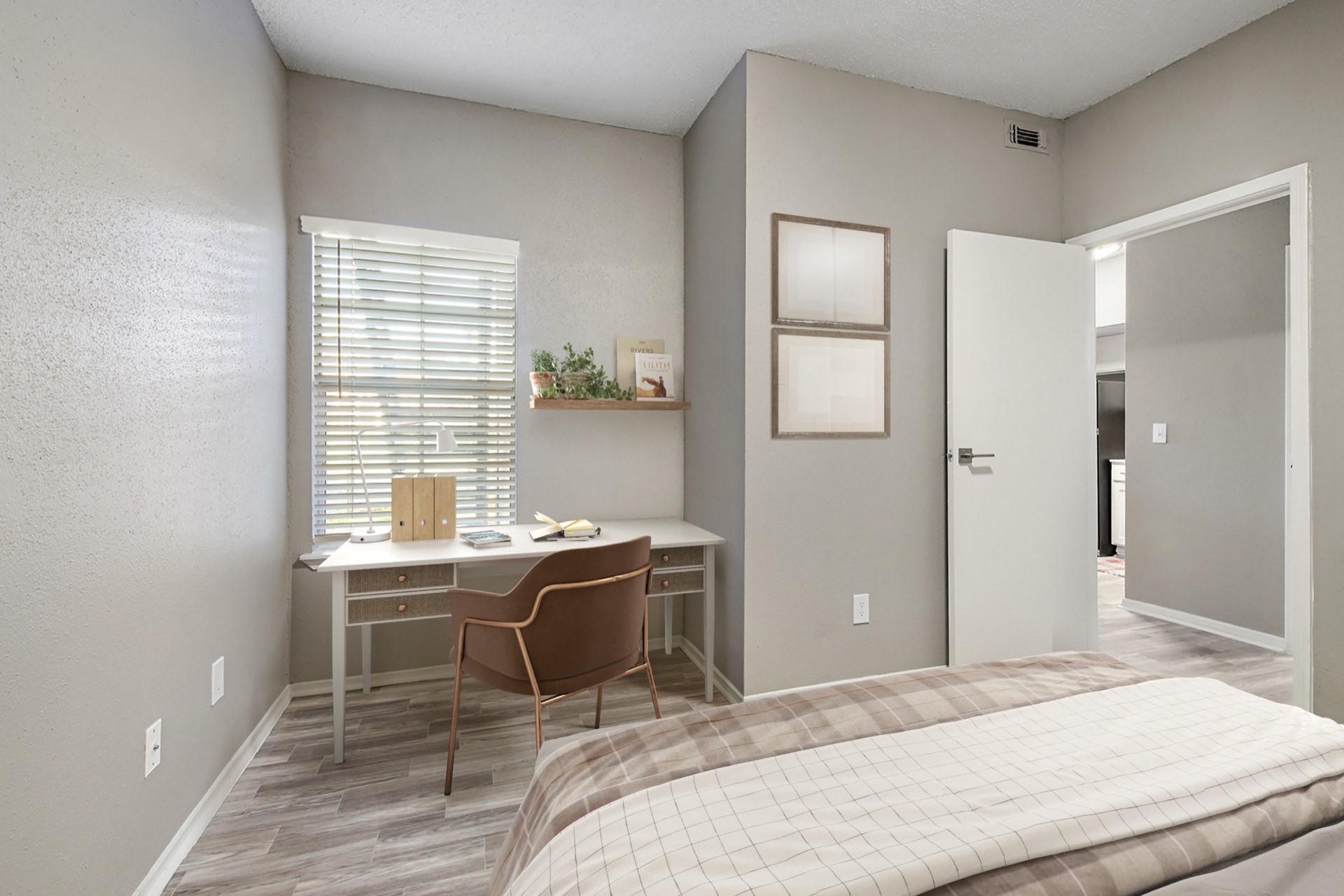 bedroom with desk nook and window