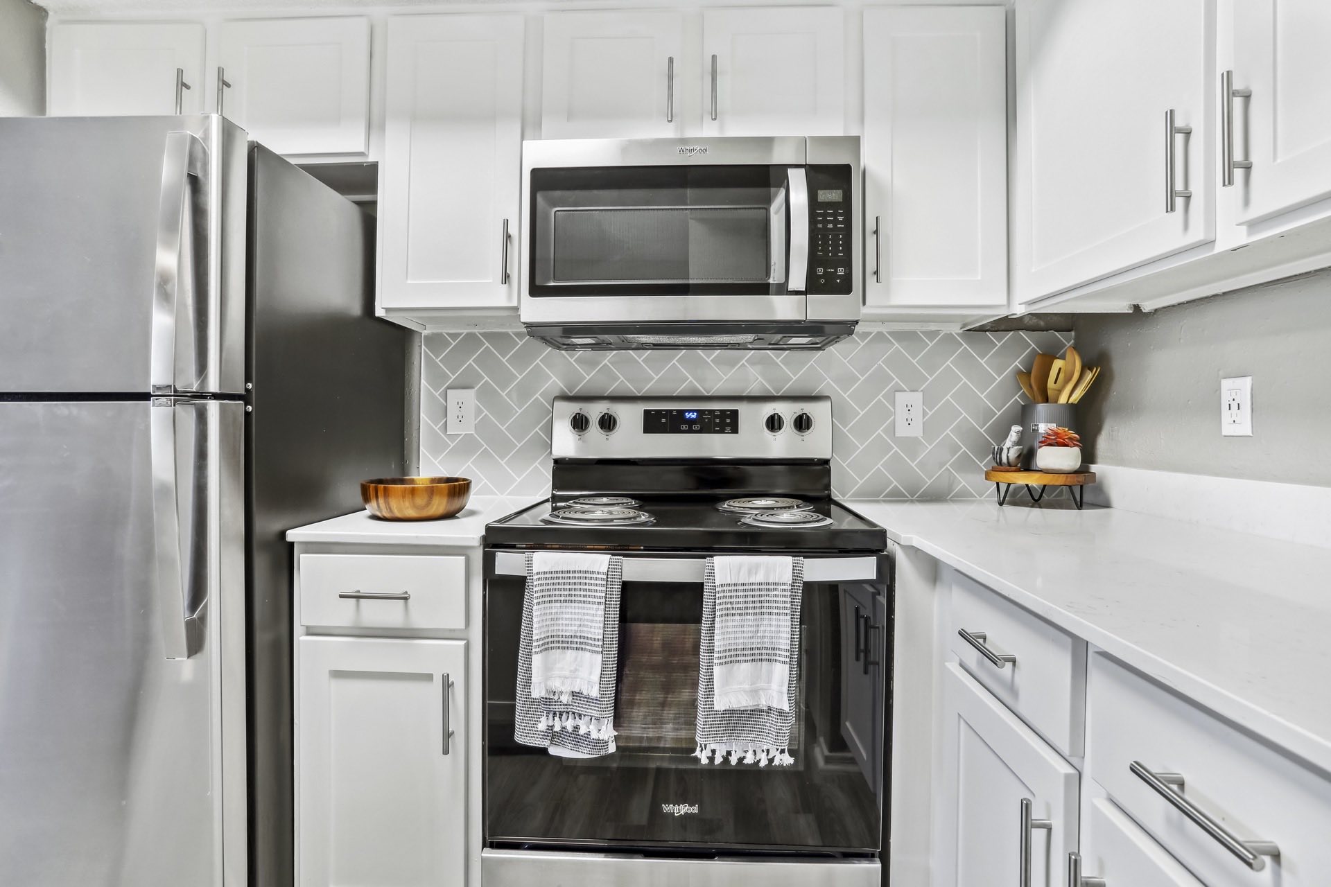 stainless steel appliances including electric range oven