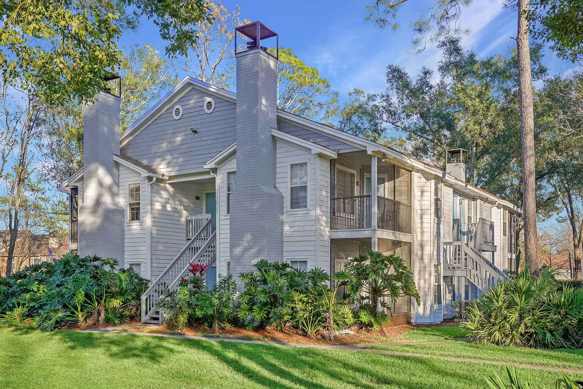 exterior of apartment building with lush landscaping